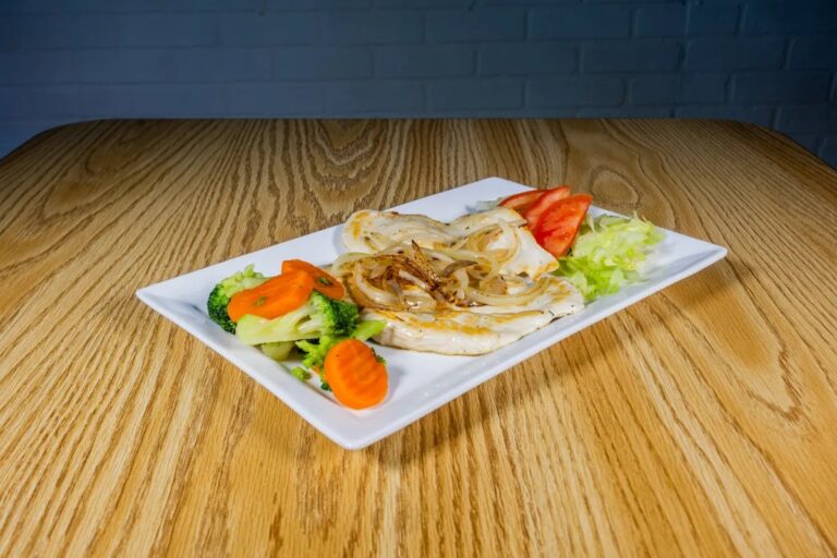 Grilled chicken breast plate with broccoli, carrots and salad, a high protein low calorie meal