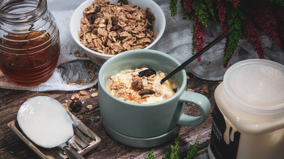 Healthy breakfast ideas on one table with yogurt, eggs, oats and fruit