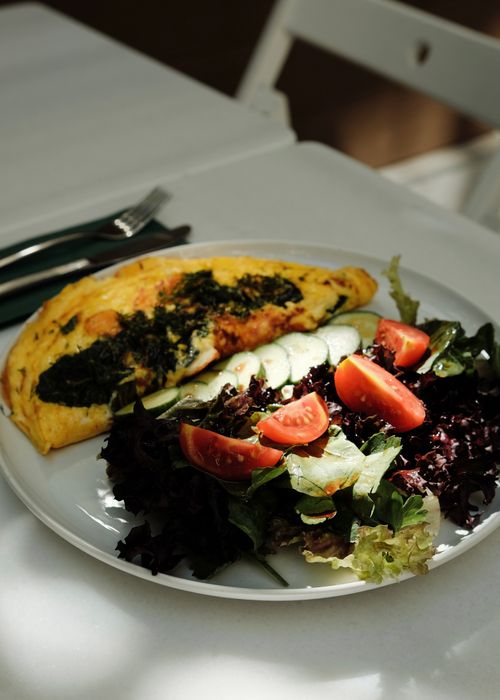 Healthy breakfast ideas with eggs, spinach omelette in a pan
